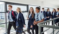 Group of high school students walking and talking