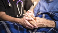 GP and patient in end-of-life care