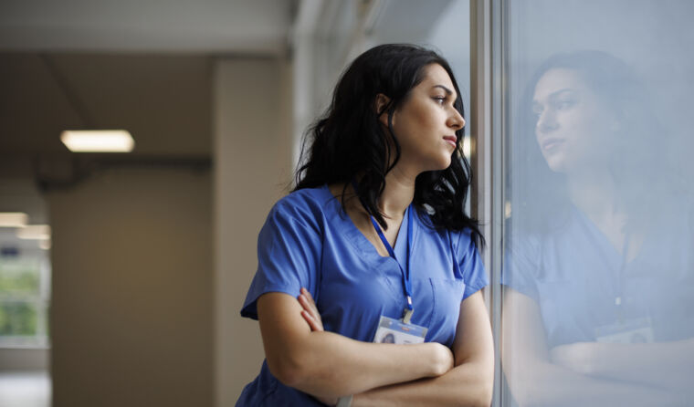 A health worker looking stressed.