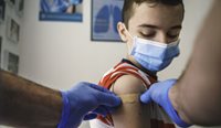 Teenage boy receiving vaccination