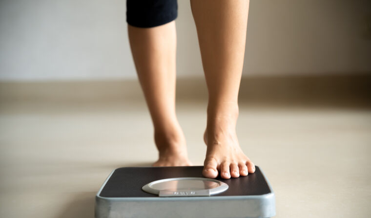 A person standing on scales