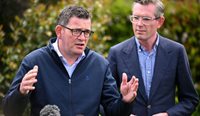 Premiers Daniel Andrews and Dominic Perrottet at a press conference last year.