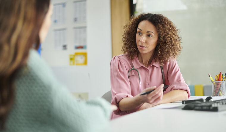 Female GP consulting