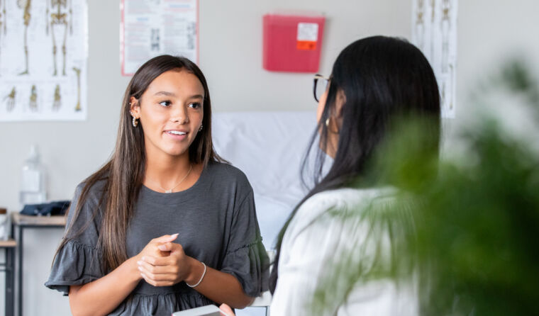 Young patient speaking with GP