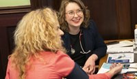 RACGP SA Deputy Chair Dr Clare Keogh doing a blood pressure check for SA Member of the Legislative Council, Connie Bonaros, at the GPs@Parliament event. (Image: Dan Trimboli)