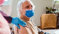 Older man being vaccinated