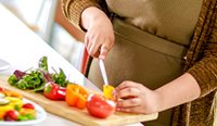 Woman chopping vegetables