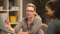 A female GP with a patient.