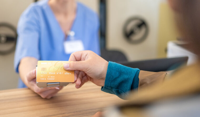 Person paying at a clinic