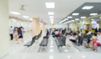 Blurred photo of busy waiting room.