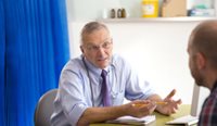 Man in consultation with GP