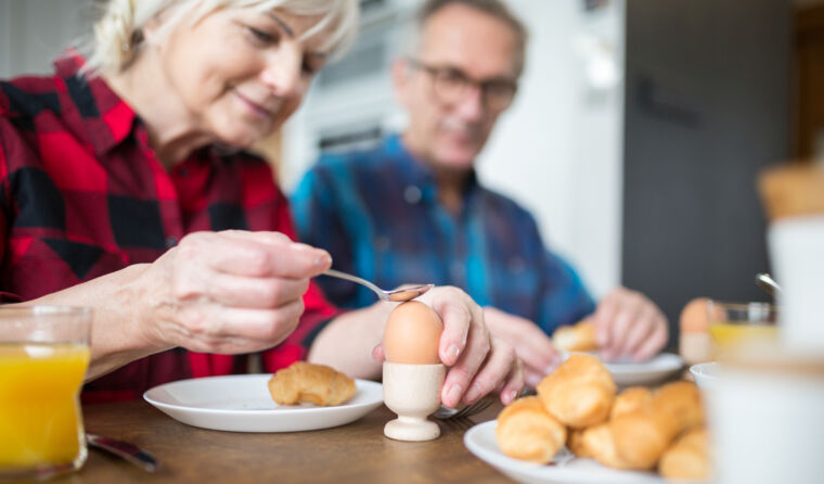 Couple eating boiled egg.