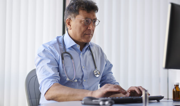 GP working on laptop