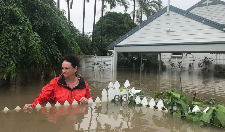 Woman in flood water