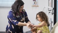 GP providing four-year-old with a health check