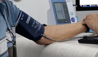 Older patient receiving blood pressure test.