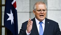 Prime Minister Scott Morrison has revealed a broad four-phase plan that will eventually see Australia return to pre-pandemic travel freedoms and life. (Image: AAP)