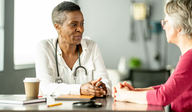 GP talking to patient seriously