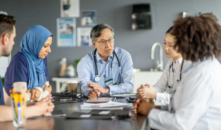 Several doctors sitting together at a table.