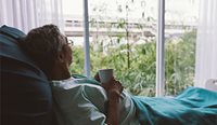 Palliative care patient looking out the window.