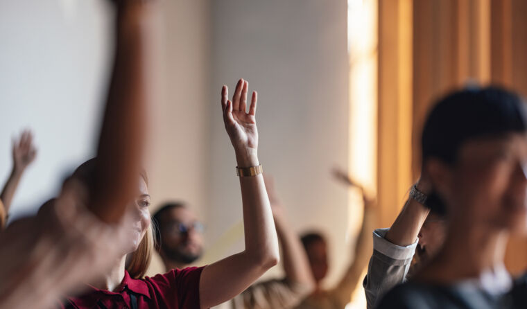People raising their hand.