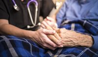 An elderly person with a doctor.