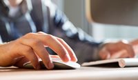 Hand on computer mouse