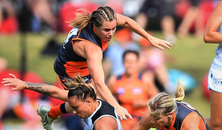 Three AFLW players converging