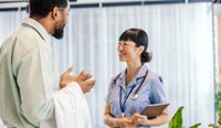 Two medical professionals talking to each other