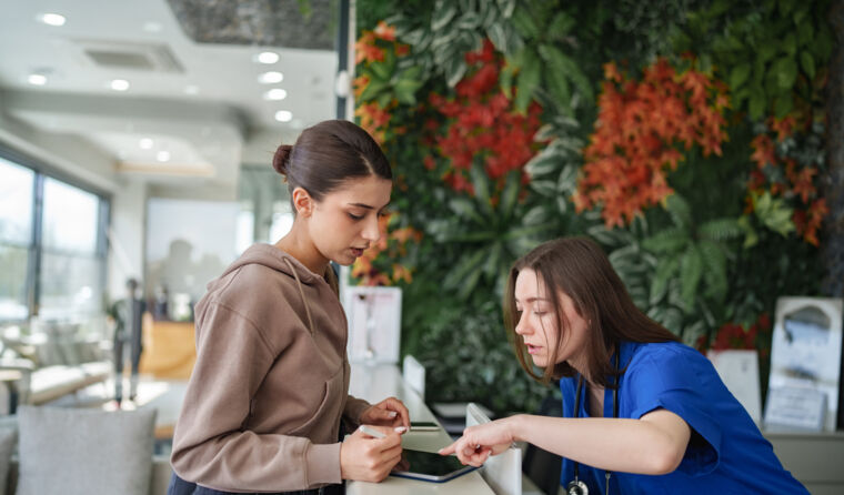 Patient paying at reception