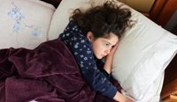 Child in bed with the flu