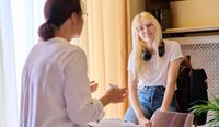 Teenage girl talking to doctor