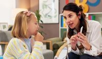 Child having therapy with speech pathologist