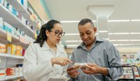 Patient talking to pharmacist about medication