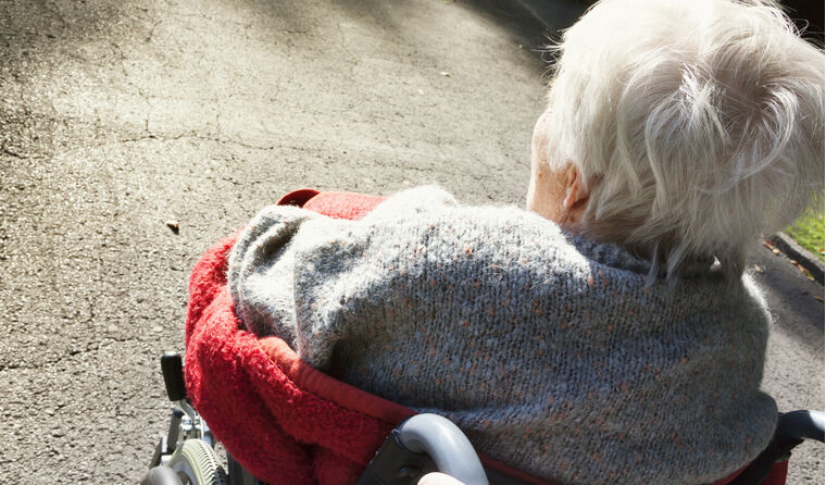 Elderly woman in wheelchair