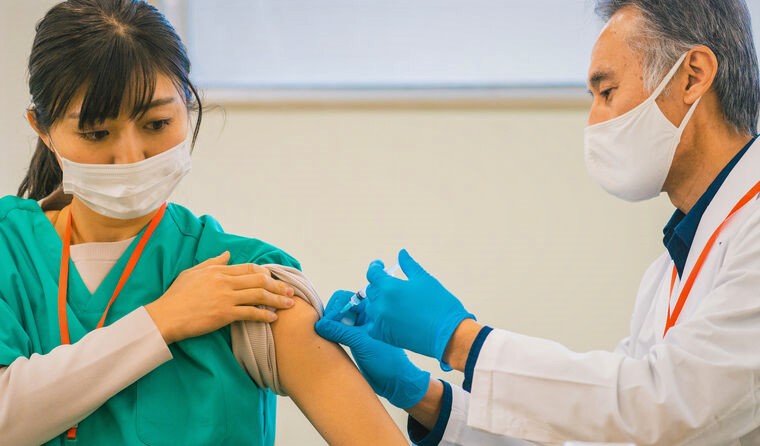 Practice nurse being vaccinated