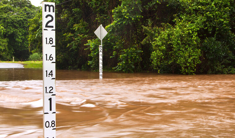 Depth marker on a flooded Queensland road.