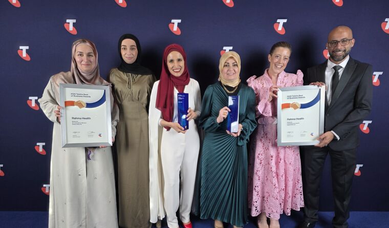 Group of Arabic people smiling, hold certificates.