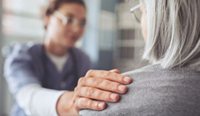 Doctor touching a patient