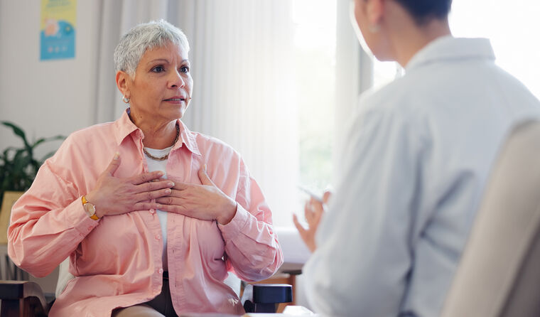 Female patient in pain consult with GP