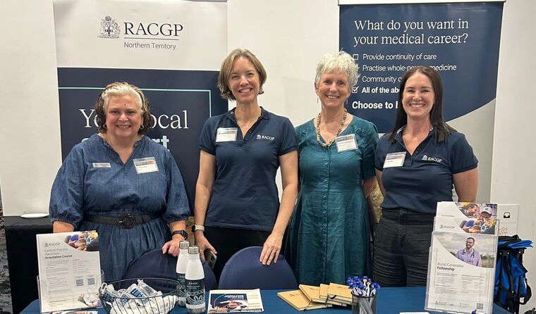 Four women in front of RACGP signage at conference