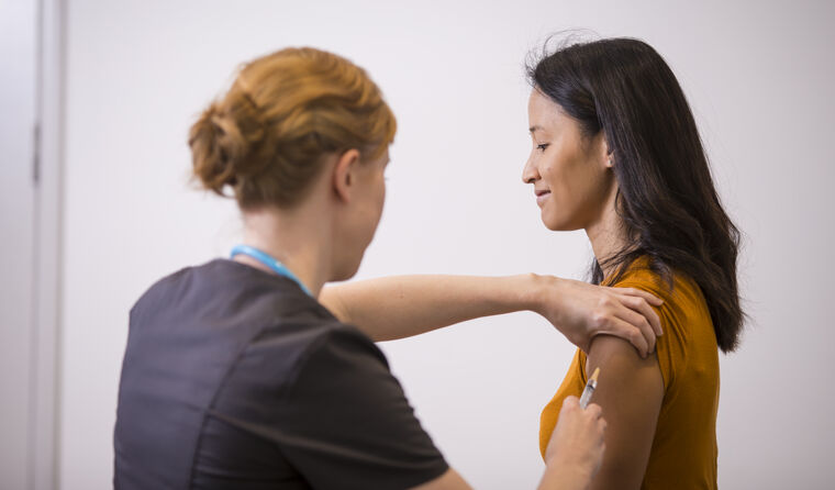 Woman receiving flu vaccination