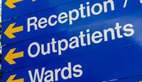 Hospital sign saying reception, outpatients, wards