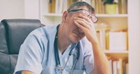 A doctor looking stressed