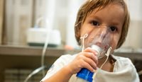 Asthmatic child using nebuliser