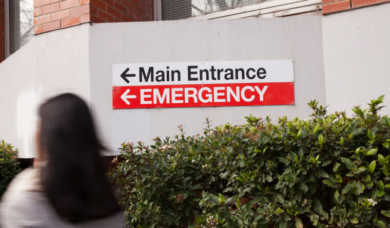 Patient walking into a hospital emergency room.