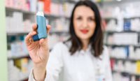 Pharmacist holding asthma puffer