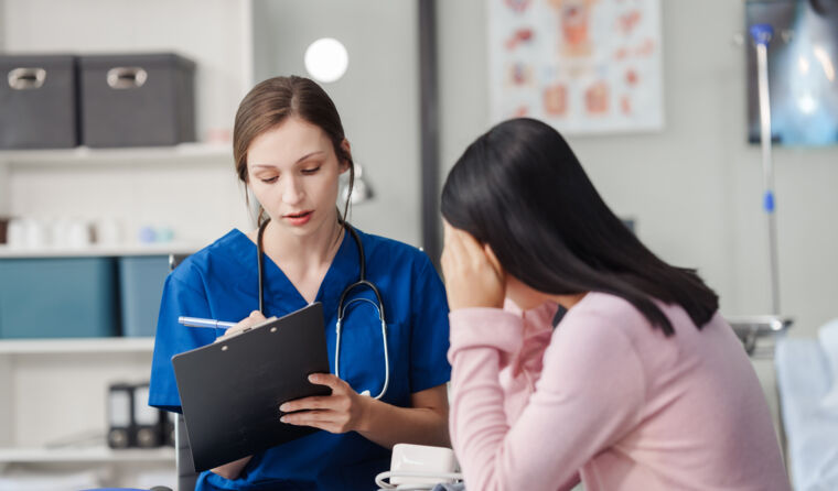 Young, anonymous woman with her GP