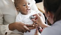GP checking baby