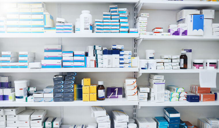 Pharmacy shelves lined with medications.